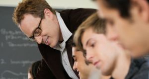 Male professor in classroom with students