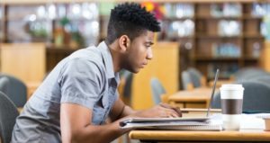 student studying in library