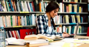 female student studying in library