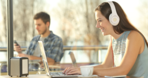 college student watching videos on laptop.