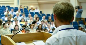 Professor standing a lectern