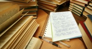 pile of books and notebook