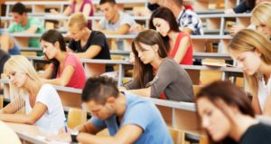 Students in a large lecture hall