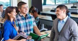 Professor chatting with students before class