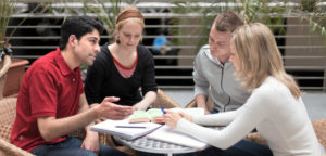 Image of a group of students engaged in a breakout session