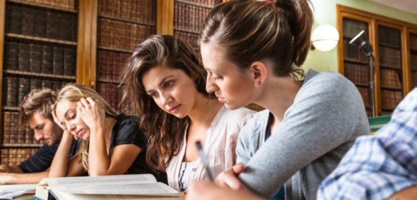 students studying at library